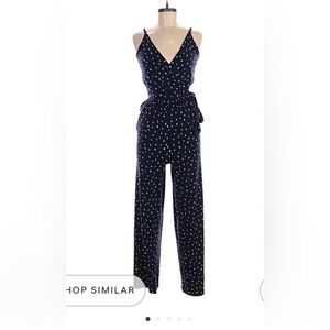 Kaileigh Navy Polka Dot Jumpsuit with bow tie detail at waist
